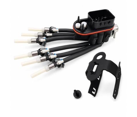 Outboard motor ignition coil pack assembly with black housing, multiple coil leads, and mounting bracket components